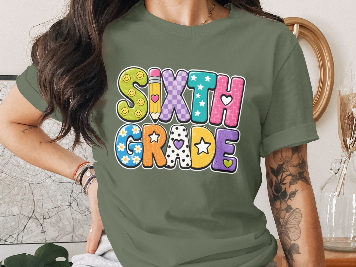 Sixth Grade text with smiley faces, pencil, checkerboard, stars, and flowers.