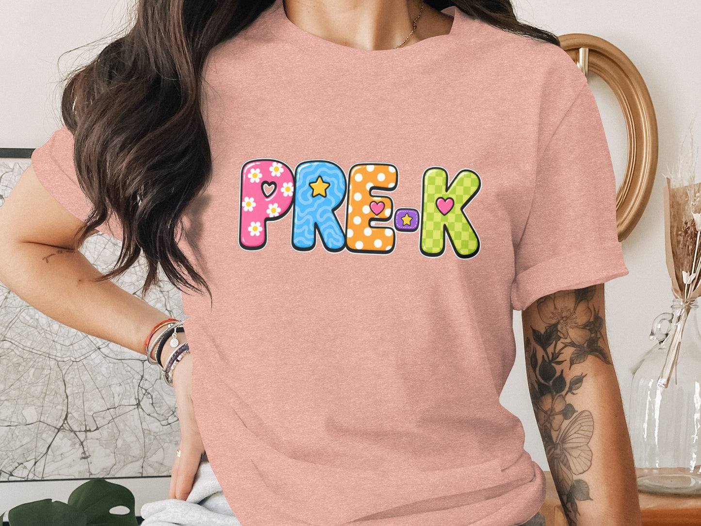 Pink t-shirt with "PRE-K" in colorful, patterned letters.
