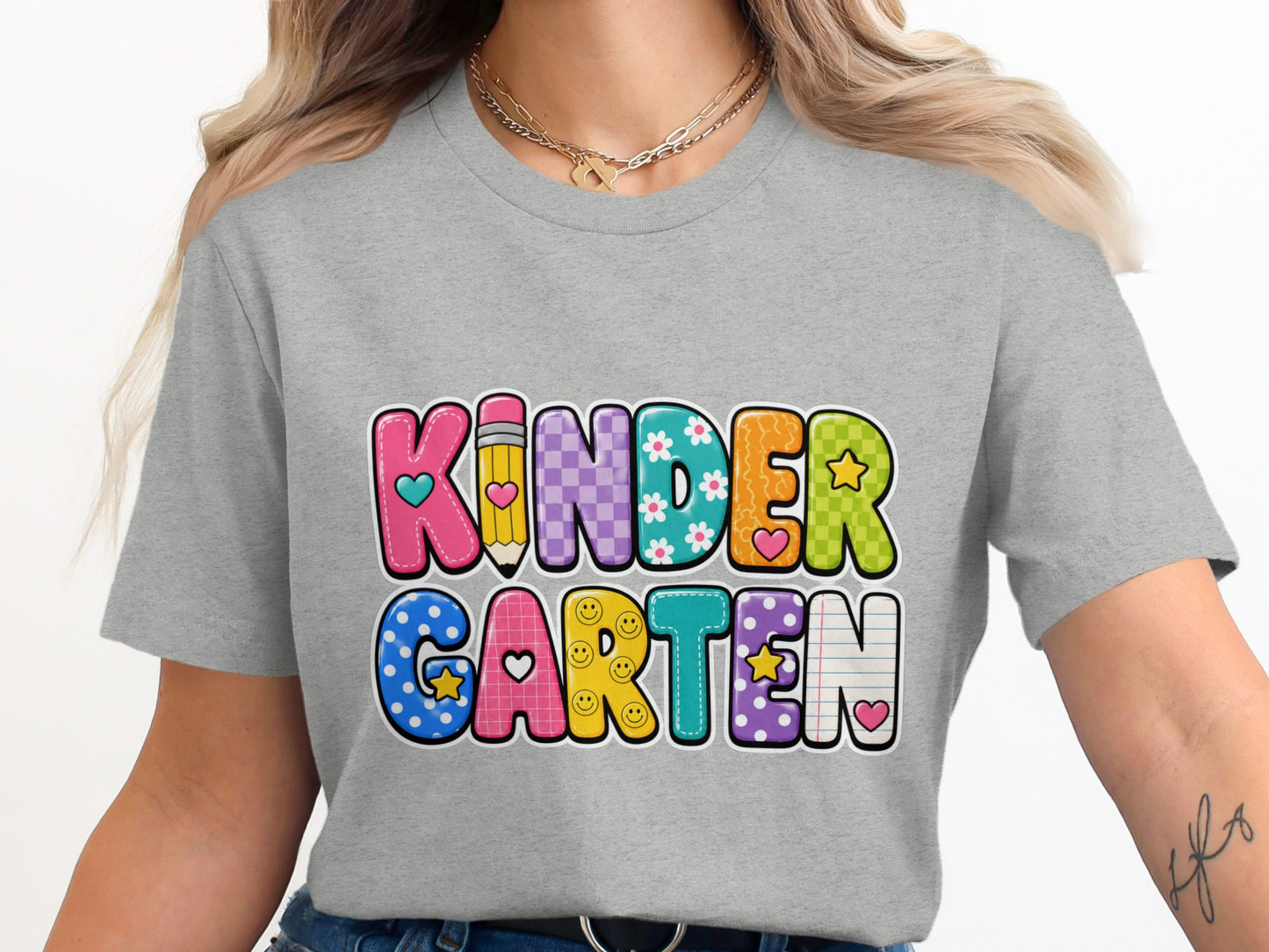 Grey t-shirt with "KINDERGARTEN" in colorful, decorated letters.