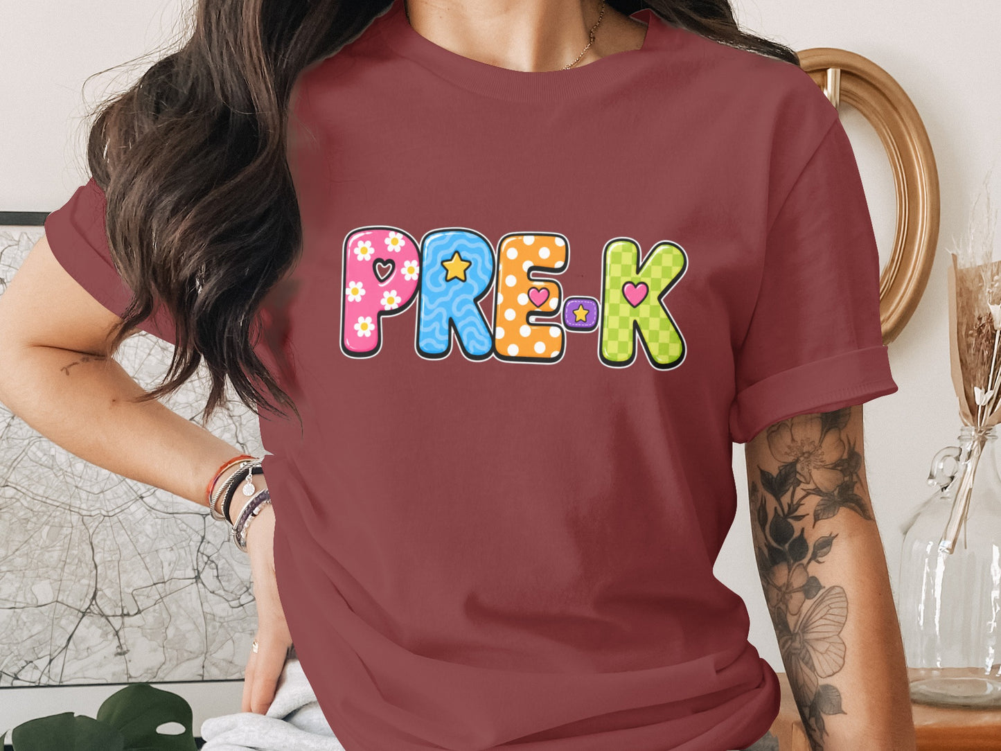 T-shirt with colorful "PRE-K" text featuring patterns and hearts.