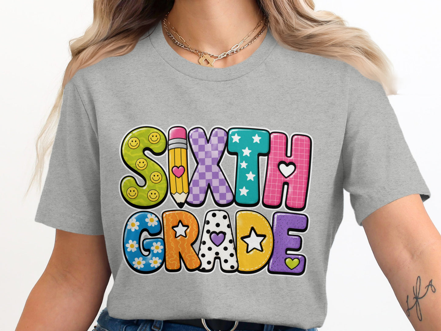 Gray t-shirt with "SIXTH GRADE" in colorful, patterned, bubble-style letters.