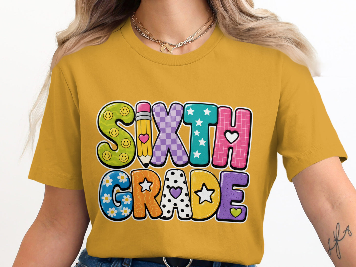 "SIXTH GRADE" text on a yellow t-shirt with colorful, patterned letters.