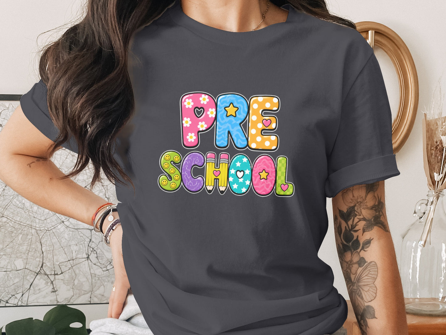 Dark grey t-shirt with colorful "PRE SCHOOL" text in playful letter shapes.