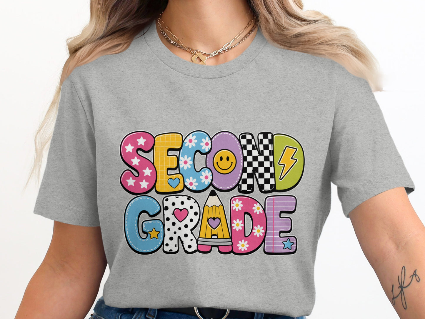 Second Grade colorful graphic lettering on a gray t-shirt.