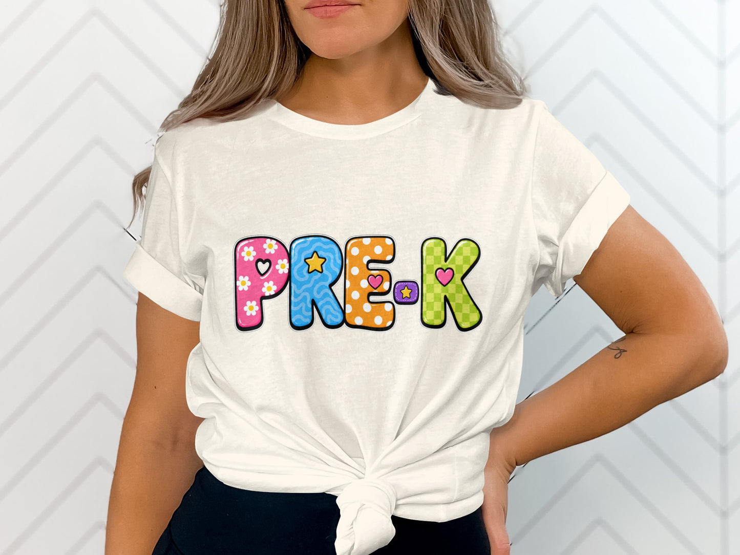 White t-shirt with colorful "PRE-K" lettering and decorative patterns.