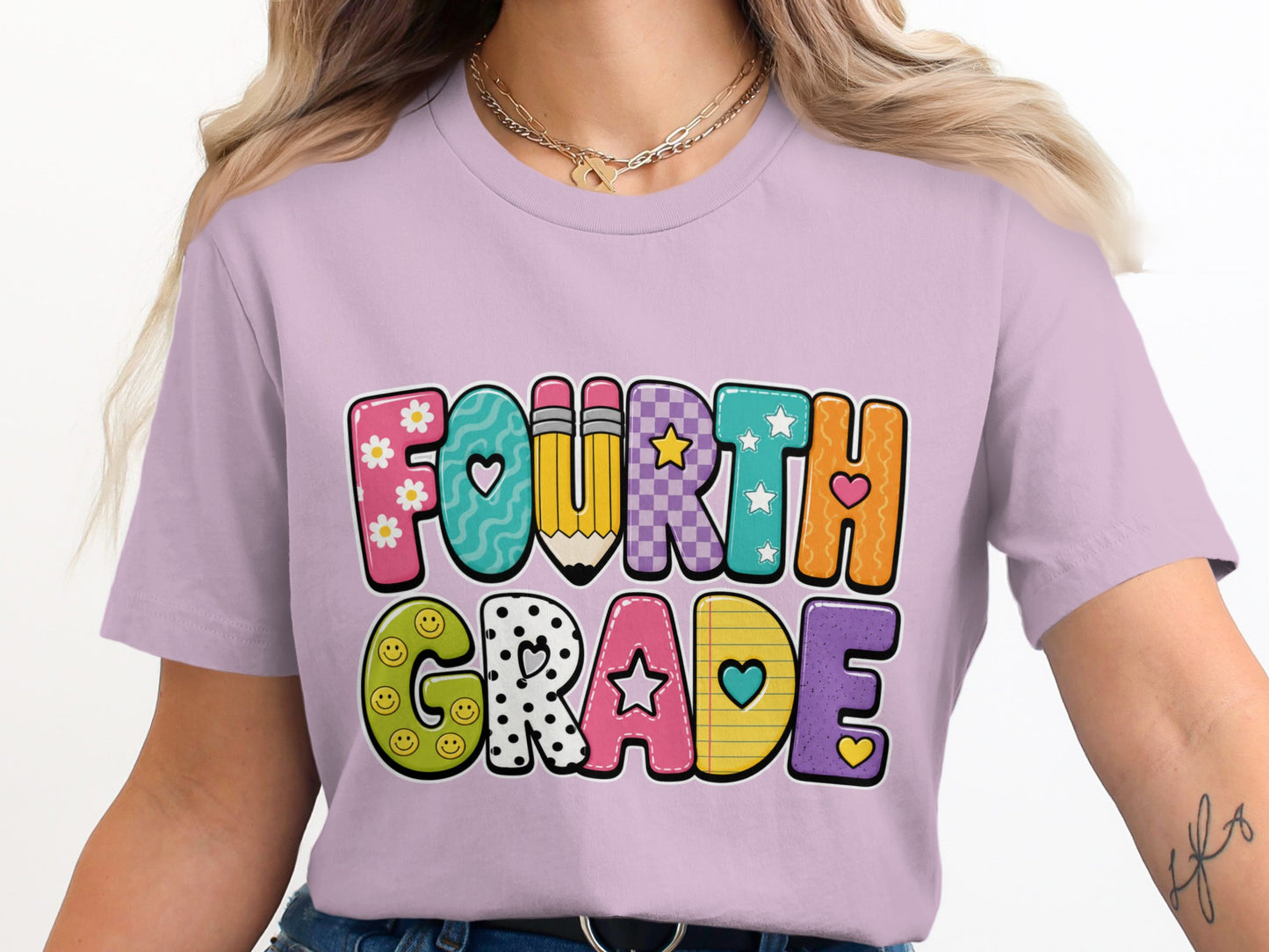 Purple t-shirt with "Fourth Grade" text in colorful, patterned letters.