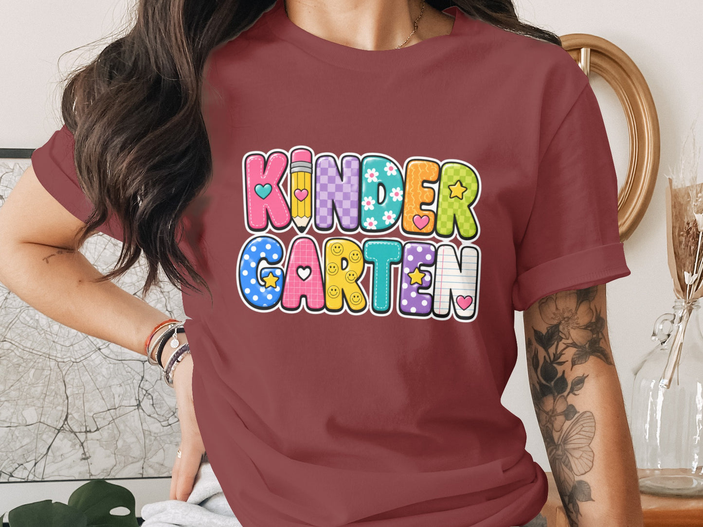 KINDERGARTEN text with colorful letters featuring pencil, flowers, hearts, and smiley faces.