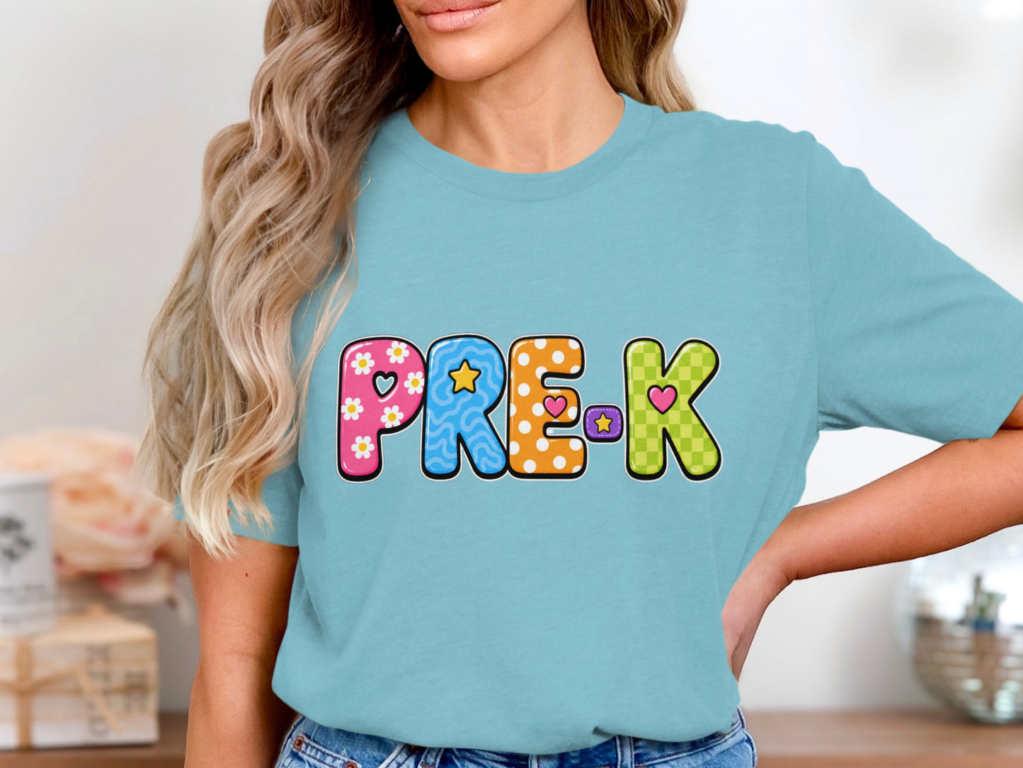 Light blue t-shirt with colorful block letters spelling "PRE-K".