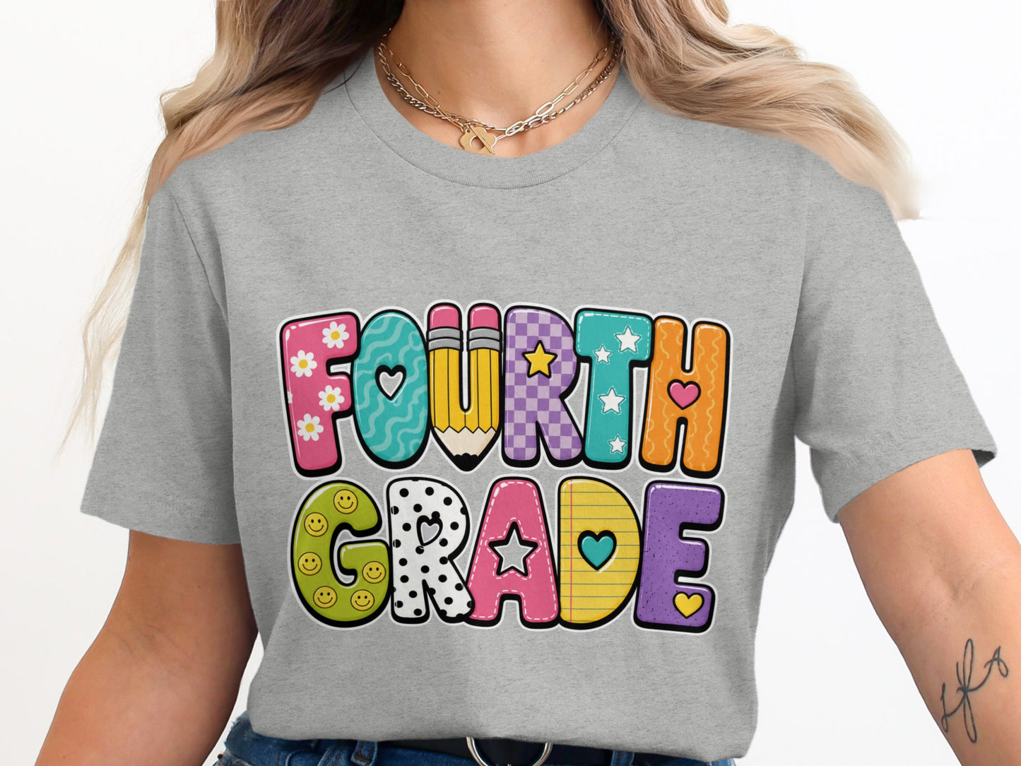 Grey t-shirt with colorful "FOURTH GRADE" text featuring playful designs.