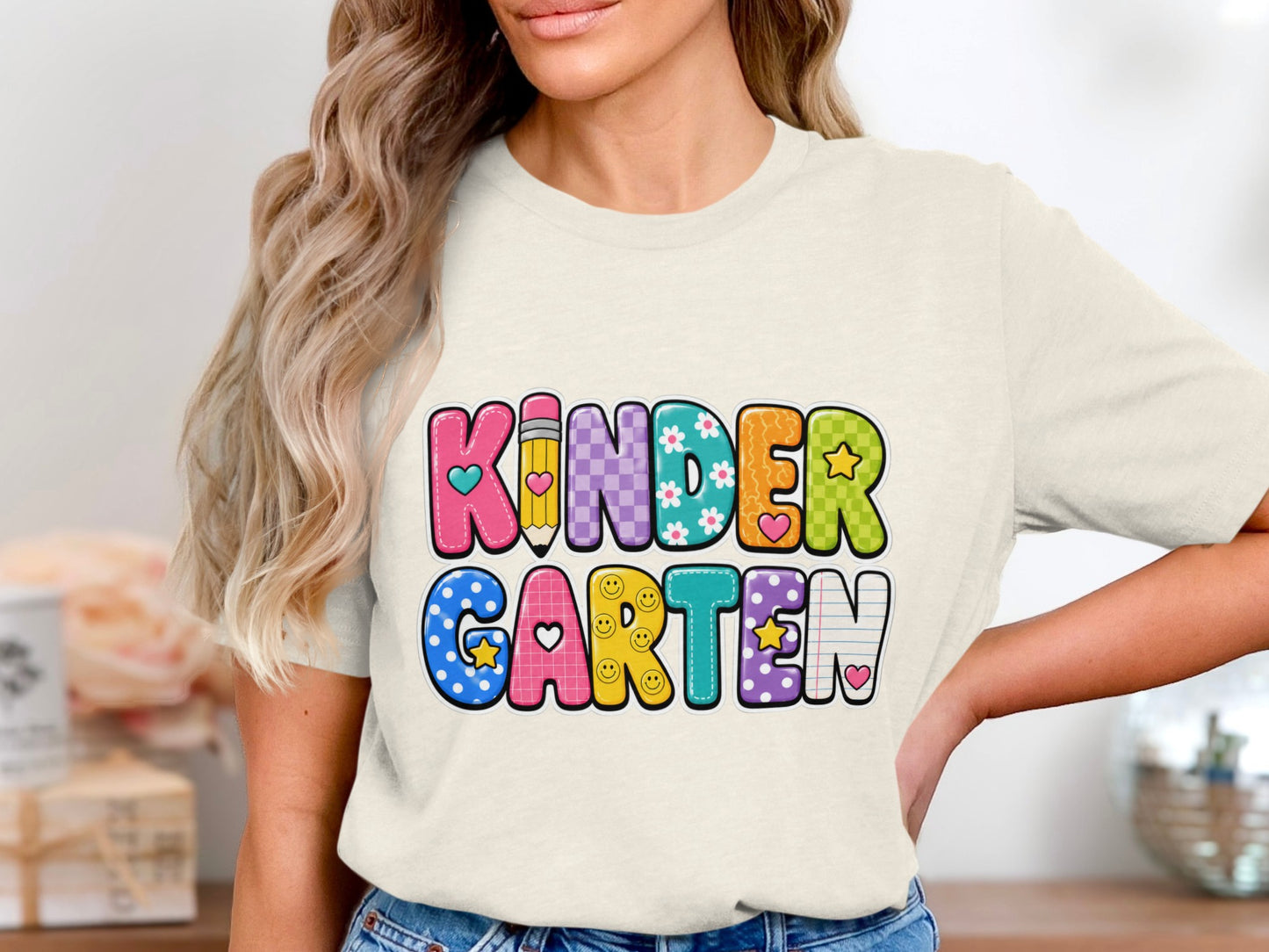 Colorful "KINDERGARTEN" text with school and smiley face themed letters.