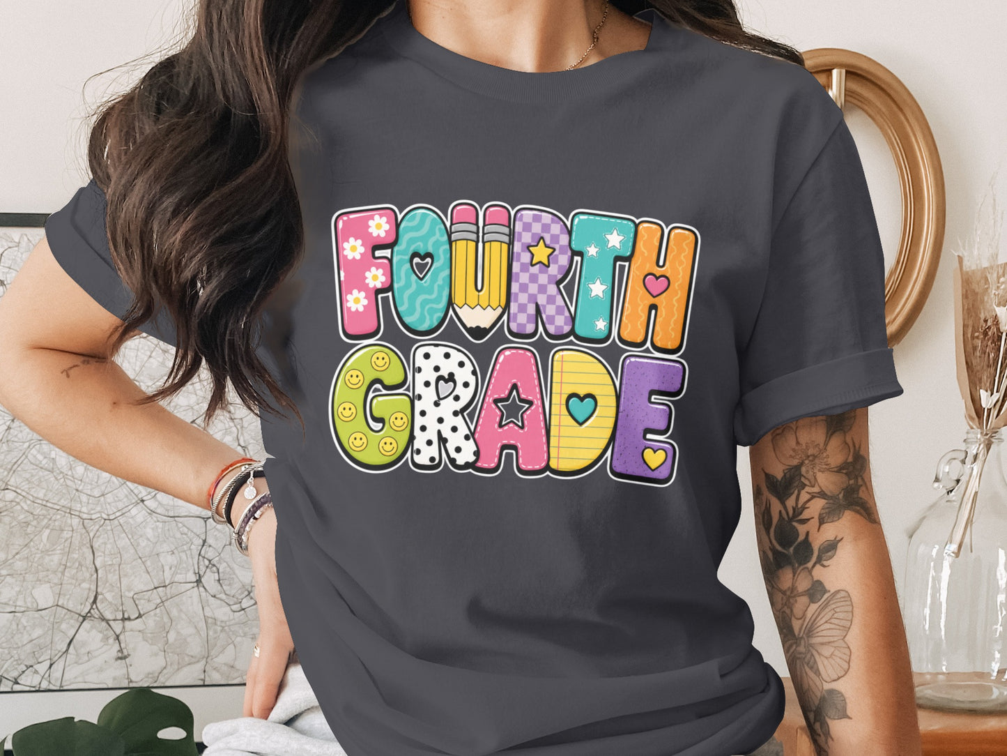 Fourth Grade colorful text with pencil, smileys, stars, and hearts graphic design.