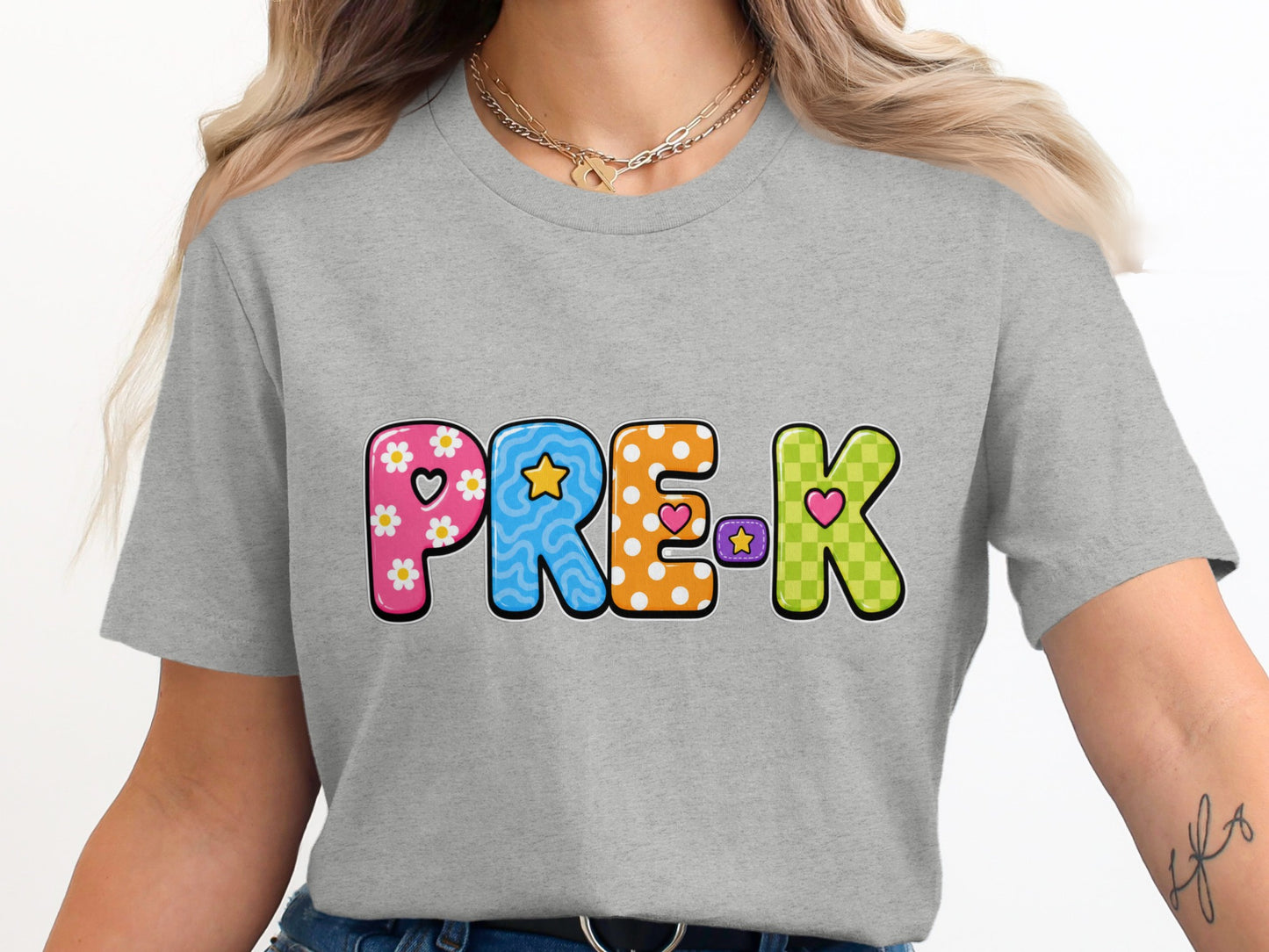 "PRE-K" graphic text on a grey t-shirt with colorful, decorative letters