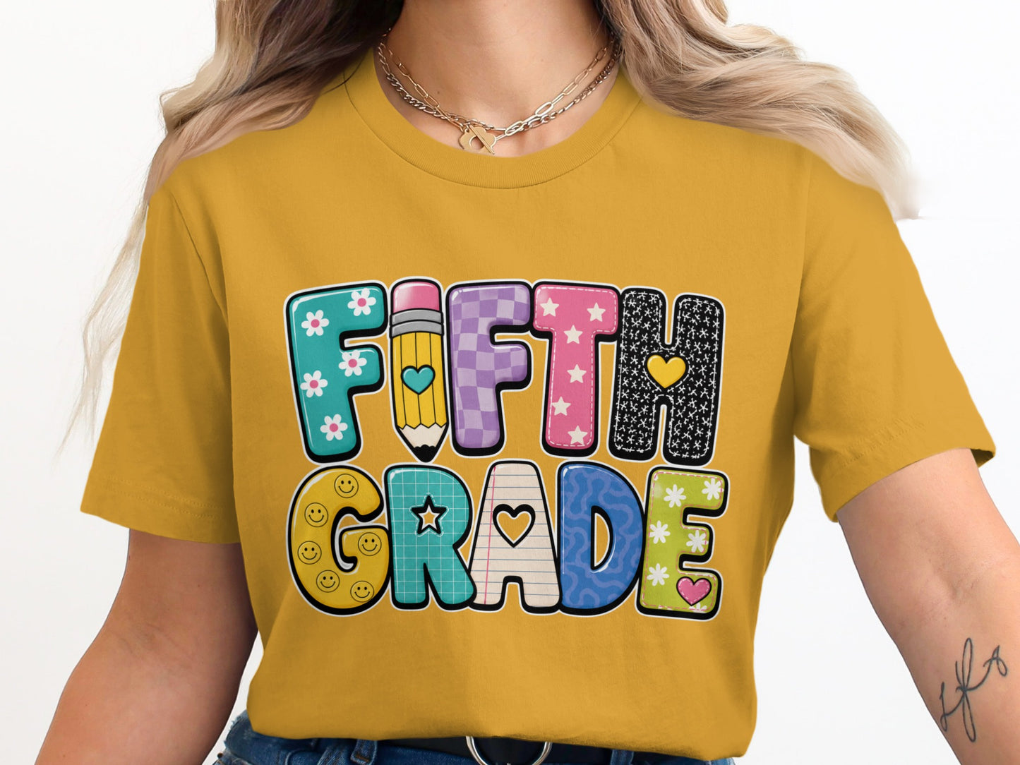 Yellow t-shirt with "FIFTH GRADE" in colorful, patterned letters.