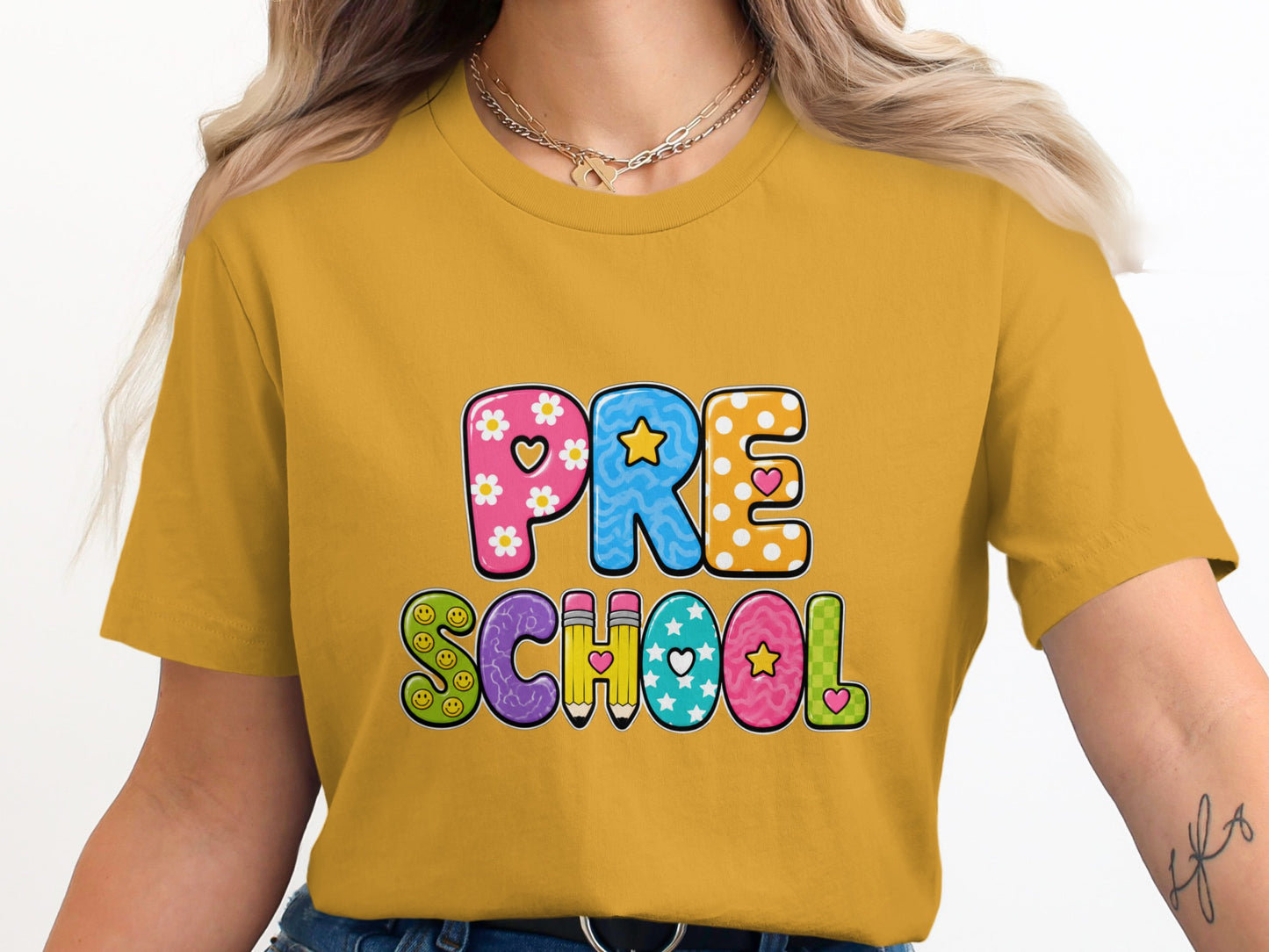 Yellow t-shirt with "PRE SCHOOL" text in colorful, decorated letters.