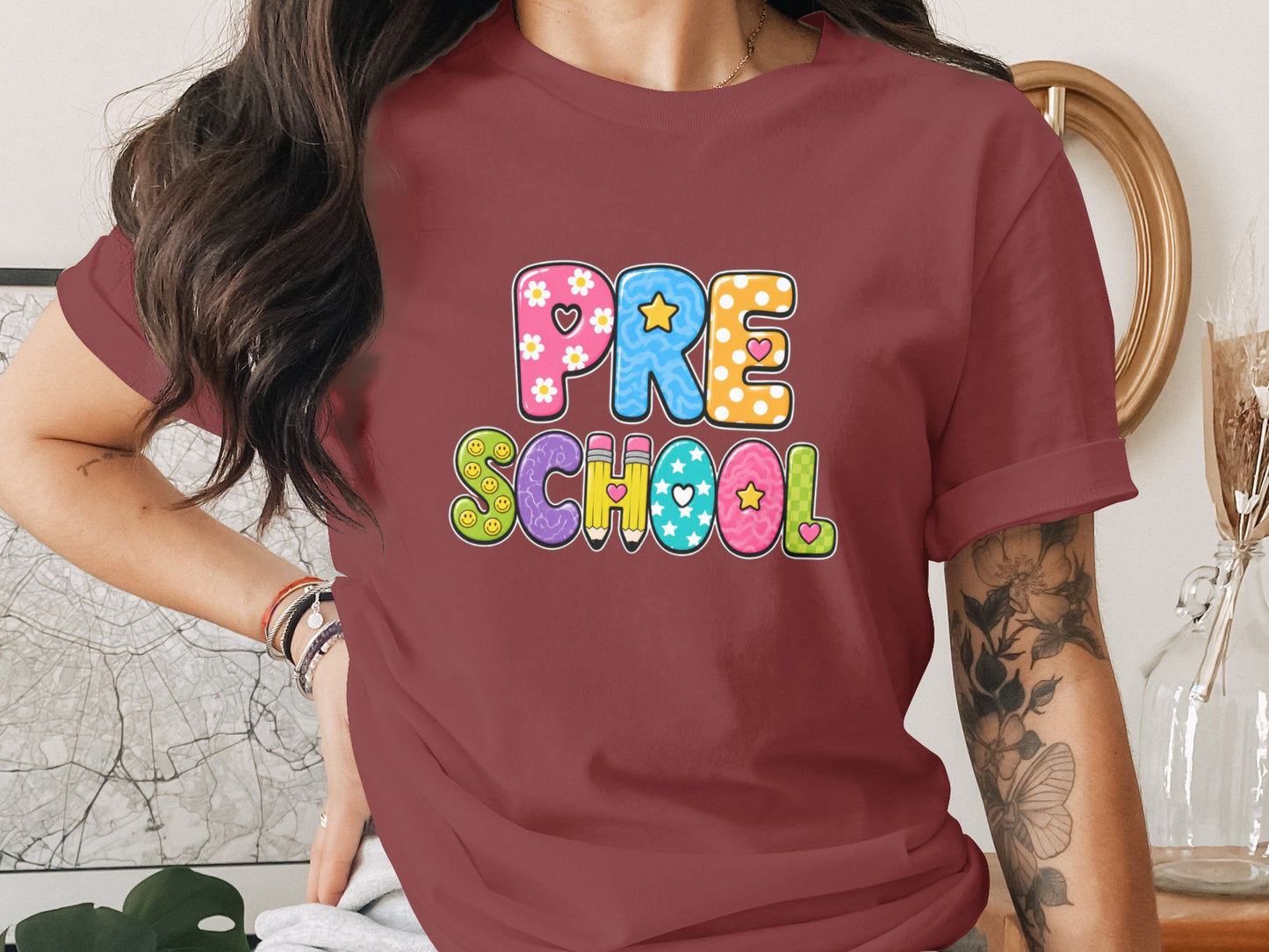 Maroon t-shirt with colorful "PRE SCHOOL" lettering and doodle art.