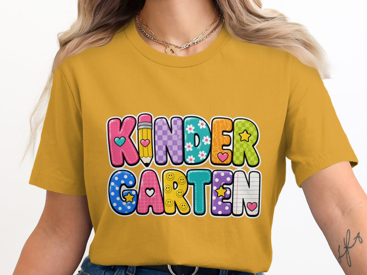 Yellow t-shirt with "KINDERGARTEN" in colorful, patterned letters.